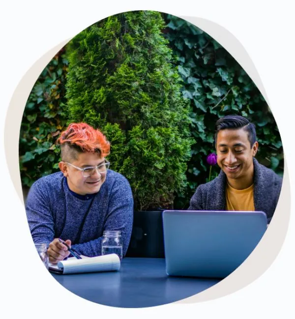 Two men working with laptop